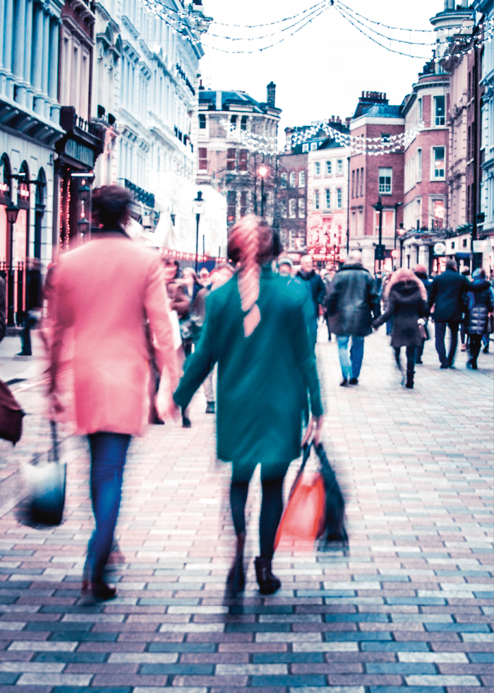 A couple shopping on busy street